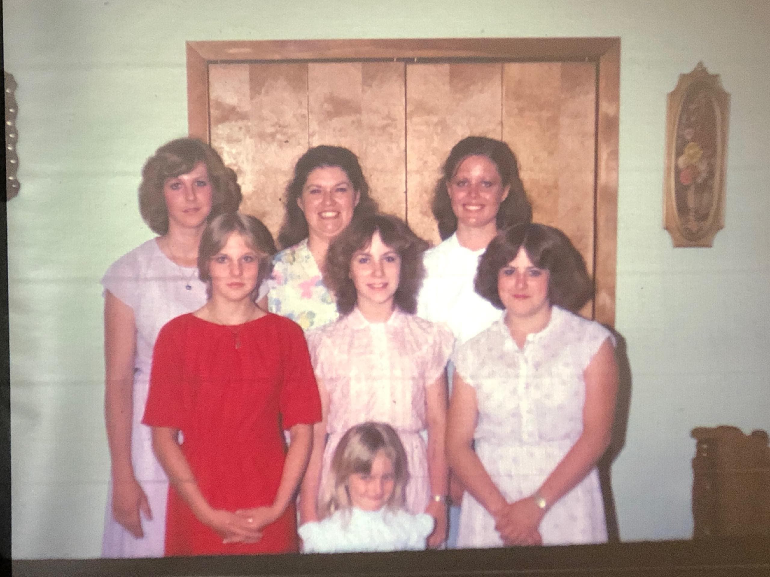 Beth Larson (a stay at home mother) Centre back with her daughters