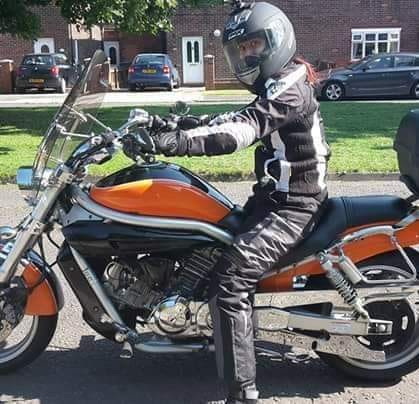Shirely-Anne smith in full riding gear on her bike